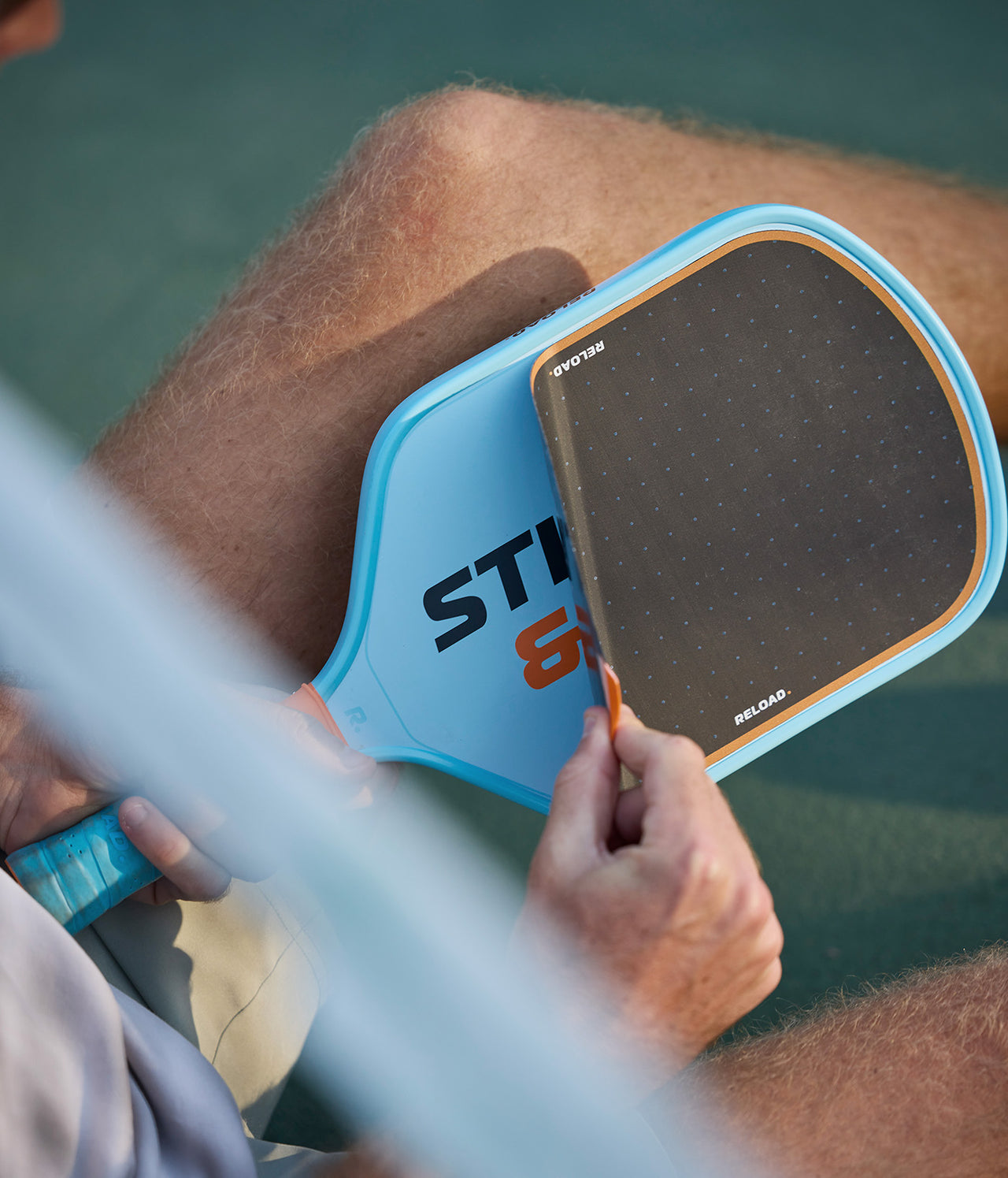 Reload - the pickleball paddle system with a replaceable surface