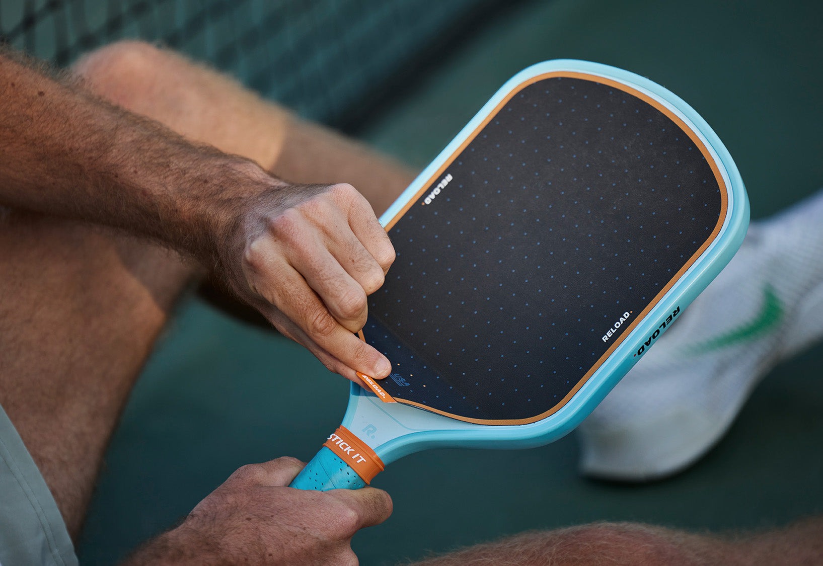 Reload - the pickleball paddle system with a replaceable surface